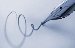 A signature being written with a fountain pen